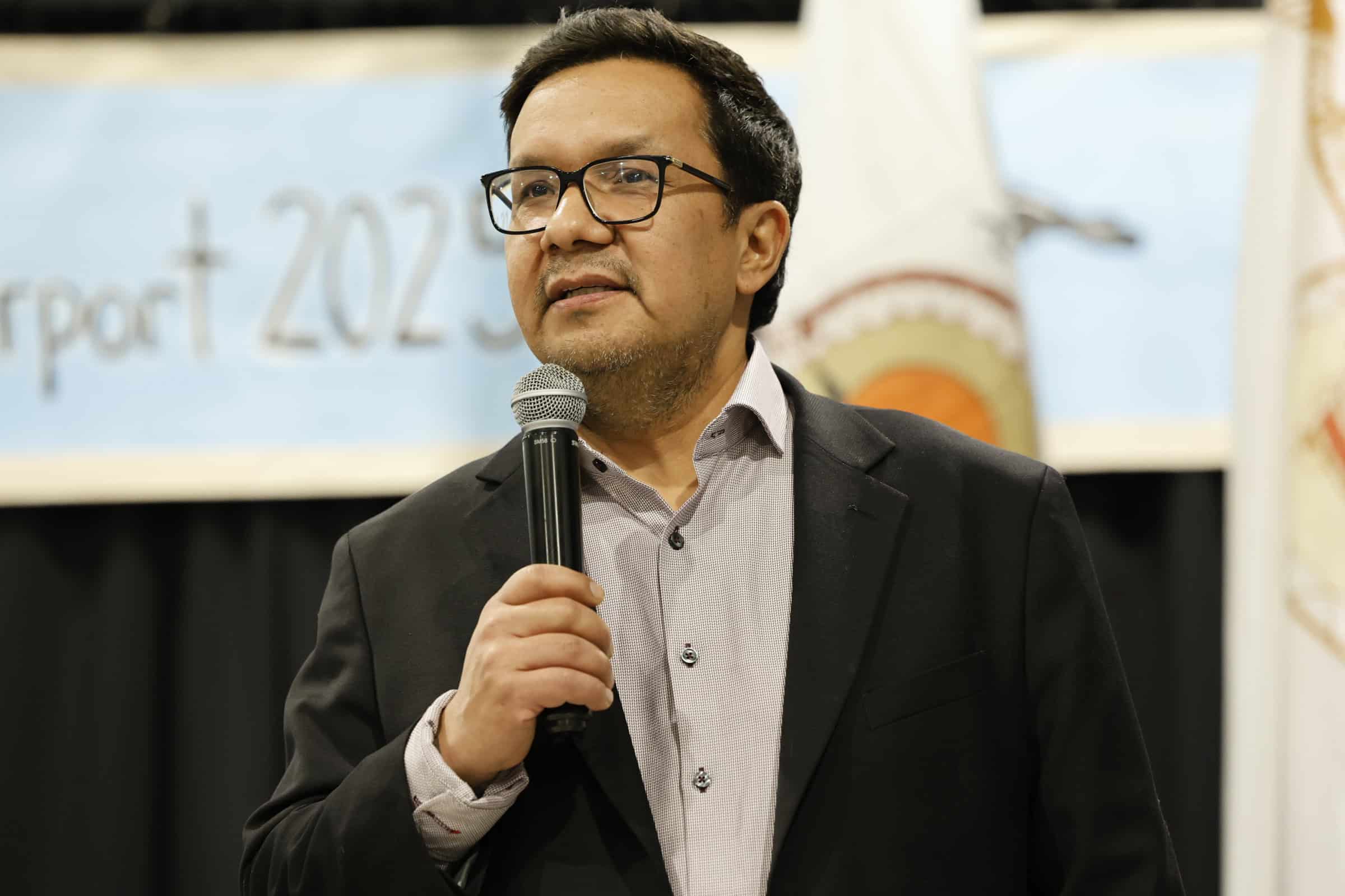 Man speaking into microphone.