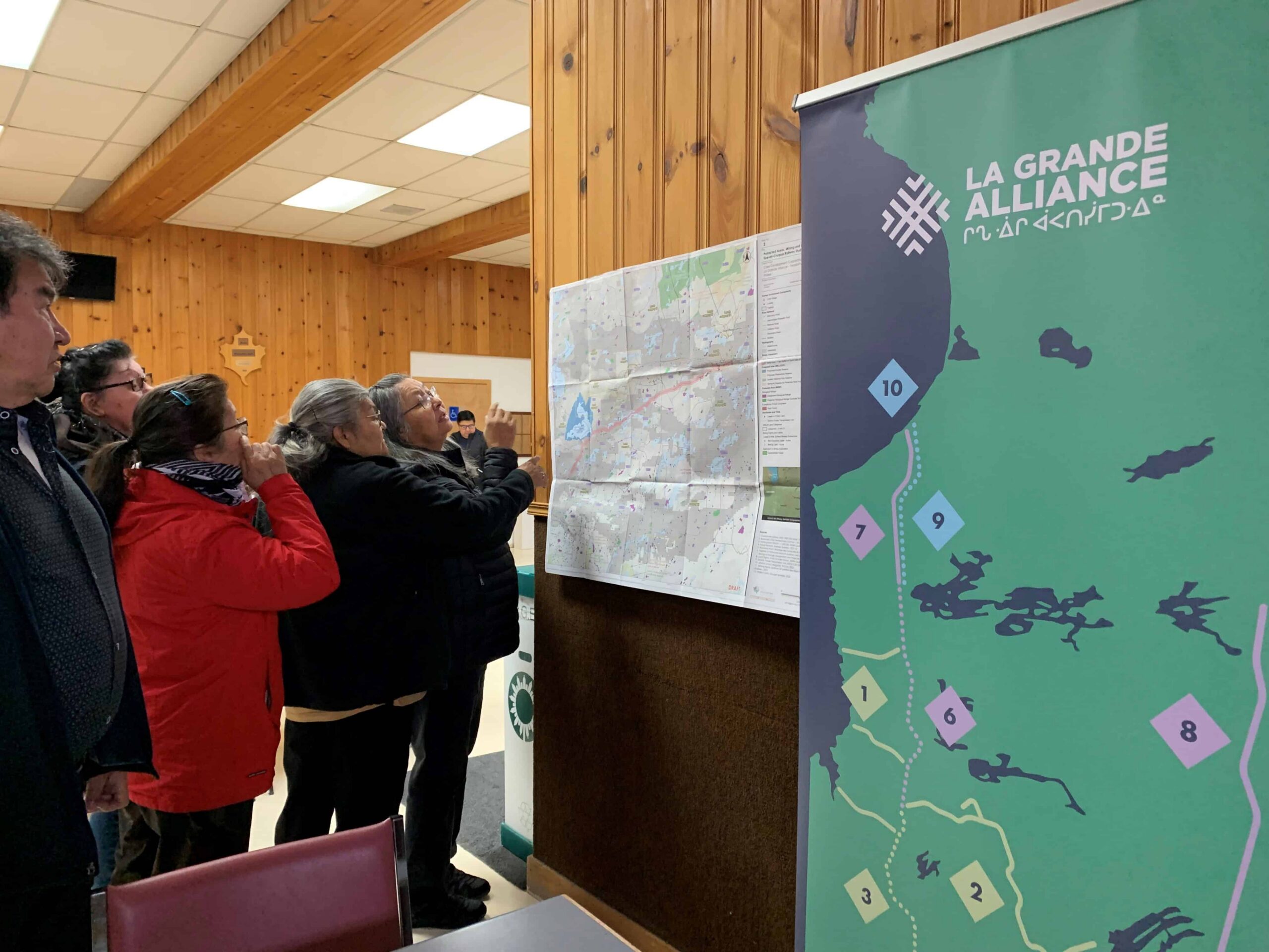 People viewing maps indoors.